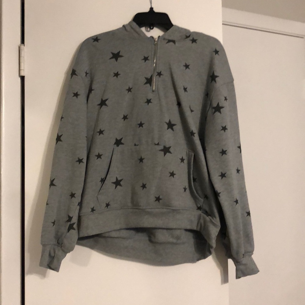 Gray and black star zip up hoodie.